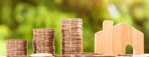 coins and house model - Renting a House in Italy
