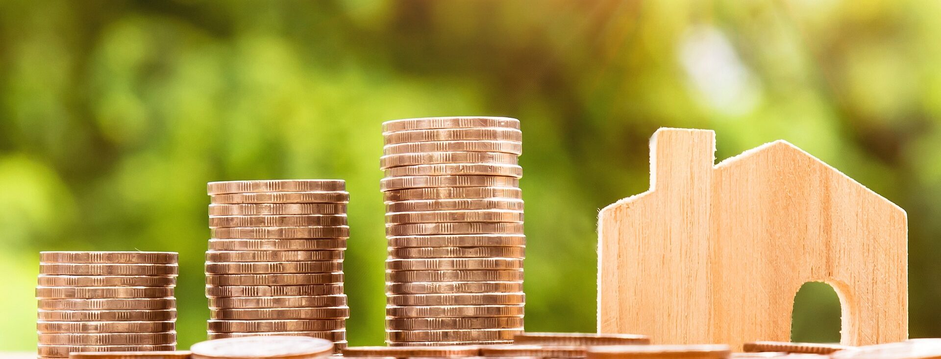 coins and house model - Renting a House in Italy